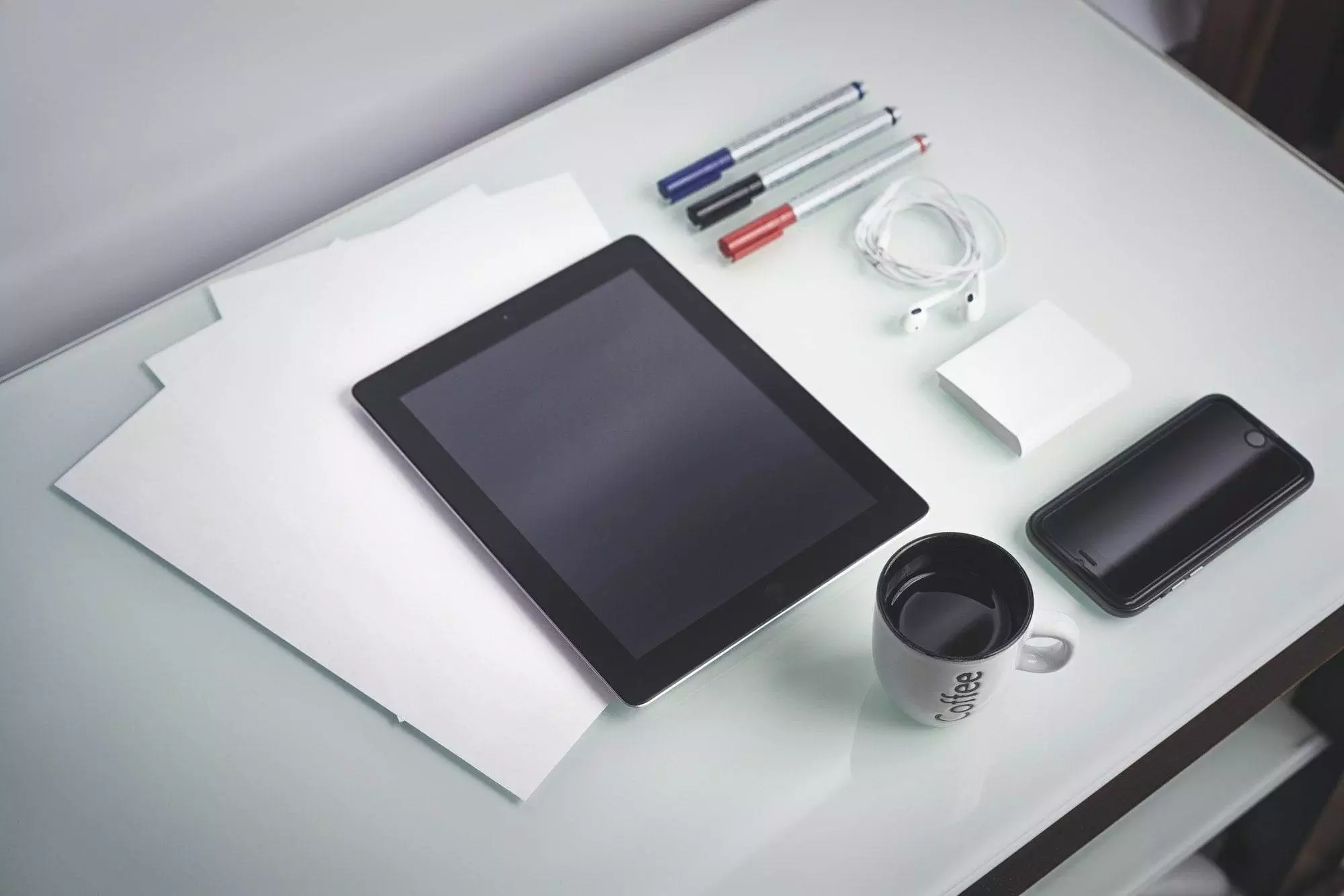 smartphone and tablet on a table concept for Web coffee a businessman